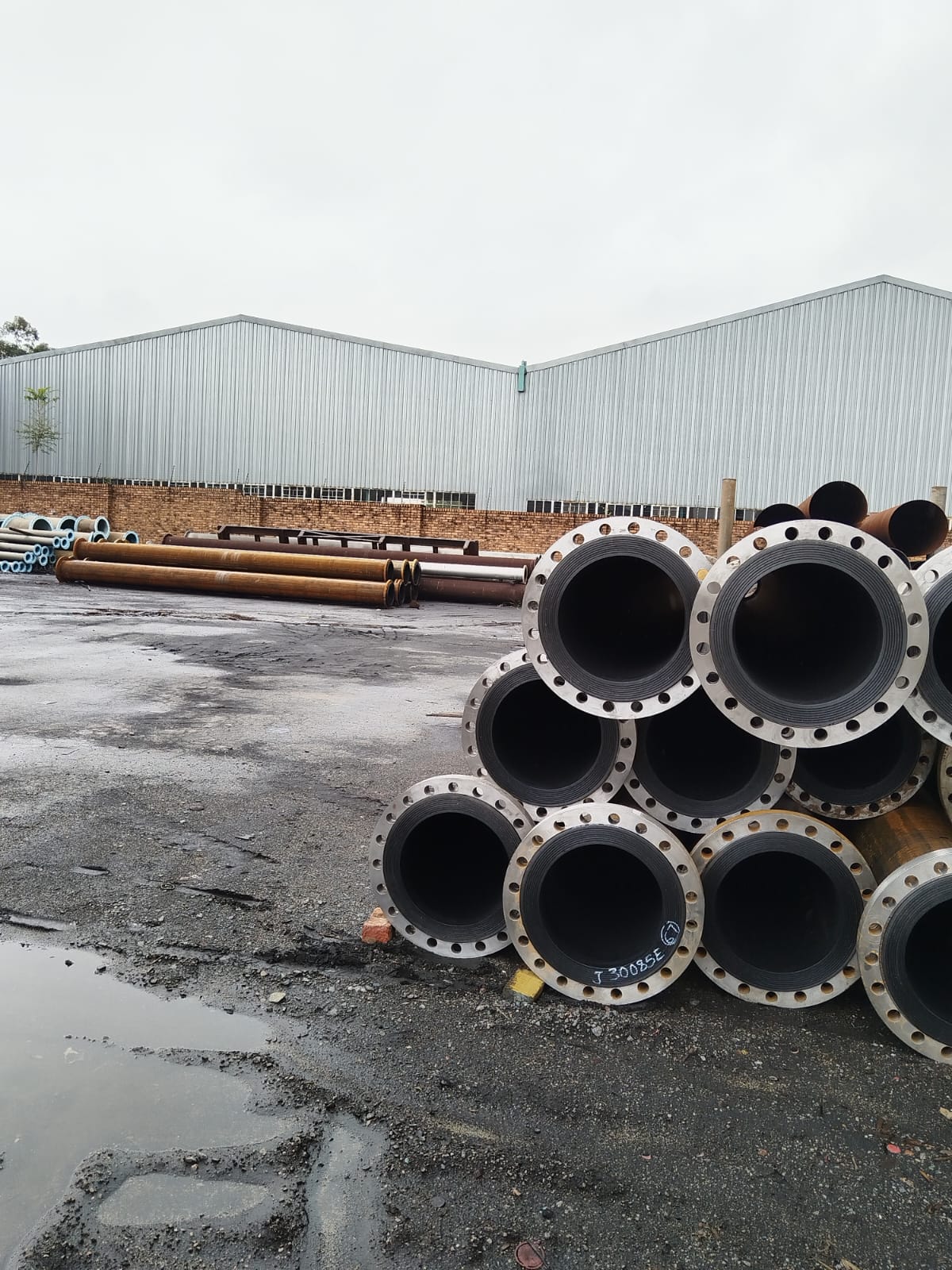 Lined flanged steel slurry pipes stocked in the Wetpipe yard ready for dispatch